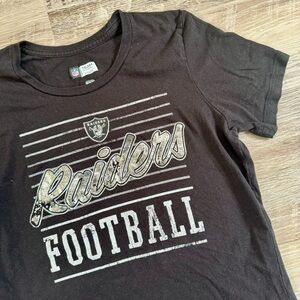 Women’s black silver Raiders NFL top shirt
Size M